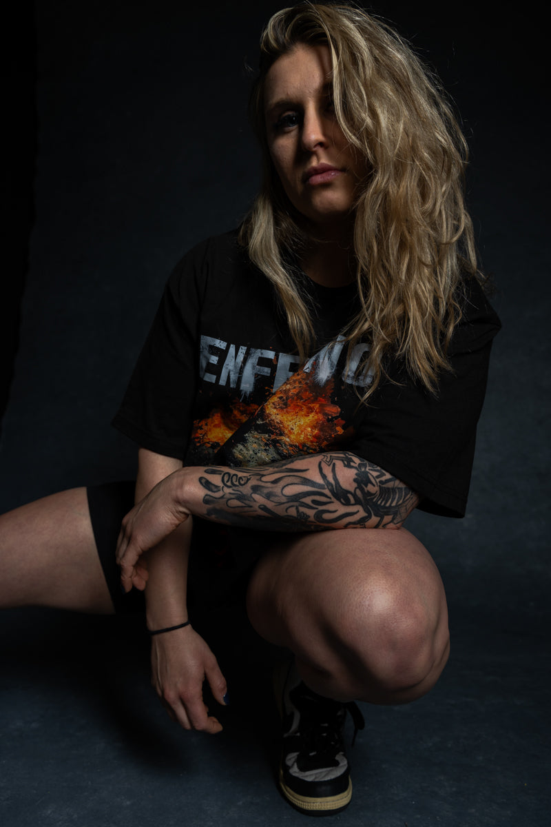 Model wearing Enferno the Fire Within Tee in Black.