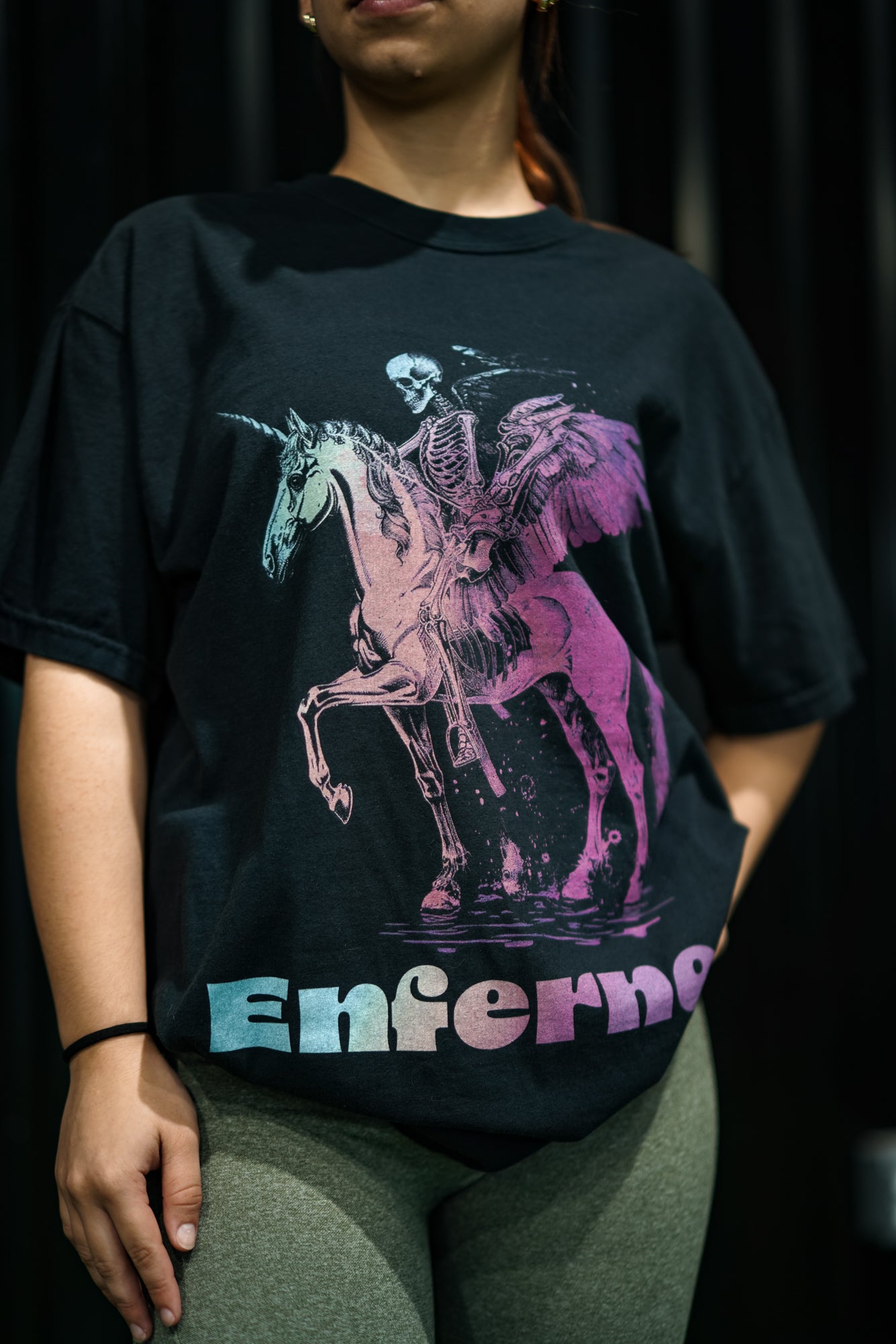Enferno Death on a Rainbow Tee in Black on model Madelyn.