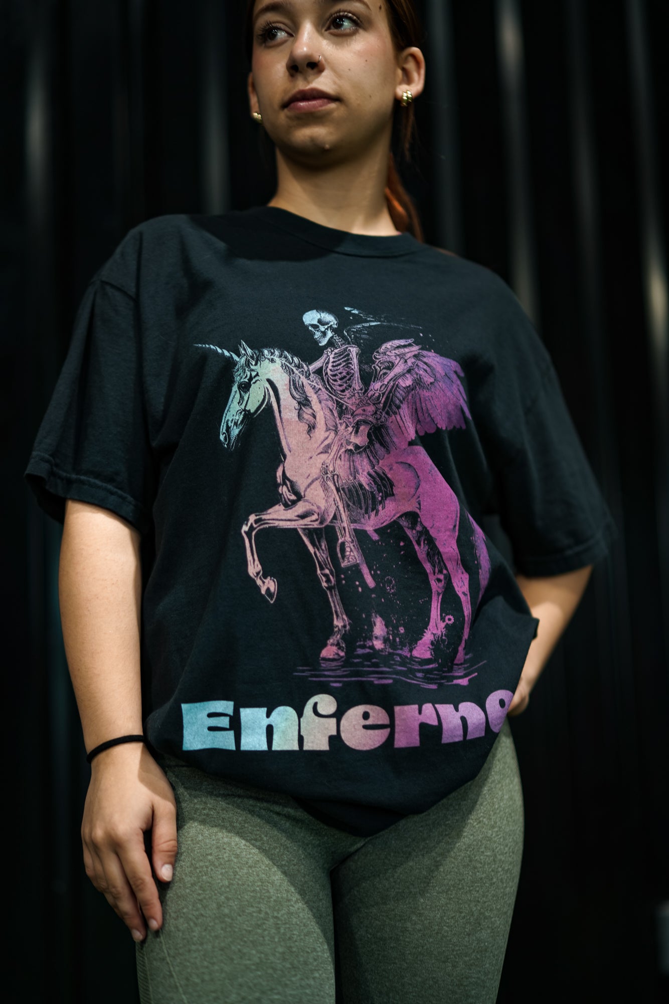 Enferno Death on a Rainbow Tee in Black on model Madelyn.