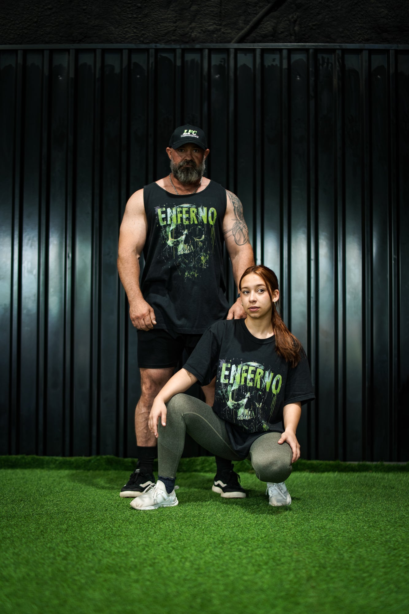 Enferno Emerald Skull Tank in Black on model Grady. Enferno Emerald Skull Tee in Black on model Madelyn.