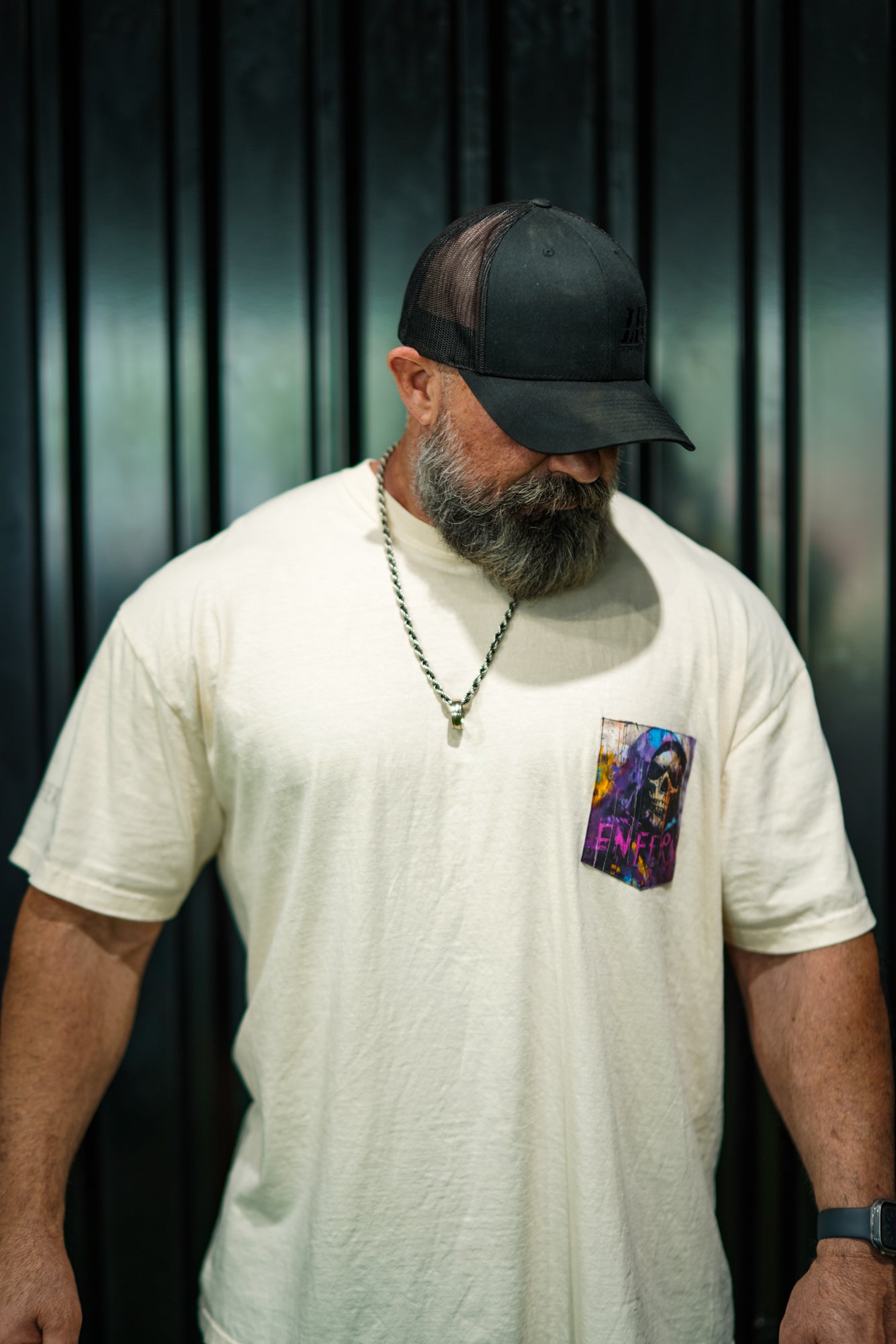 Enferno Diet Face Pocket Tee in Ivory on model Grady.