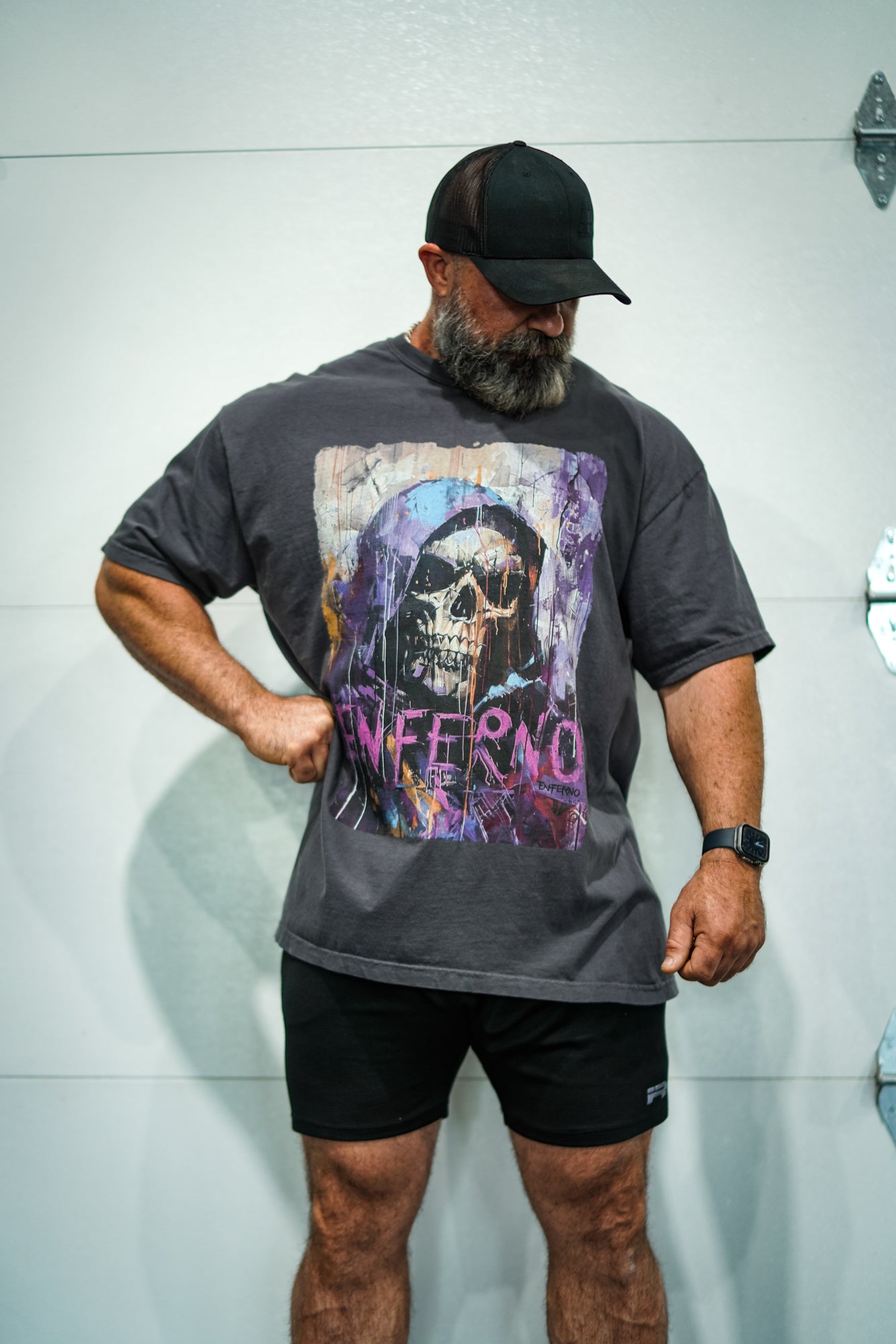 Enferno Diet Face Tee in Graphite on model Grady.