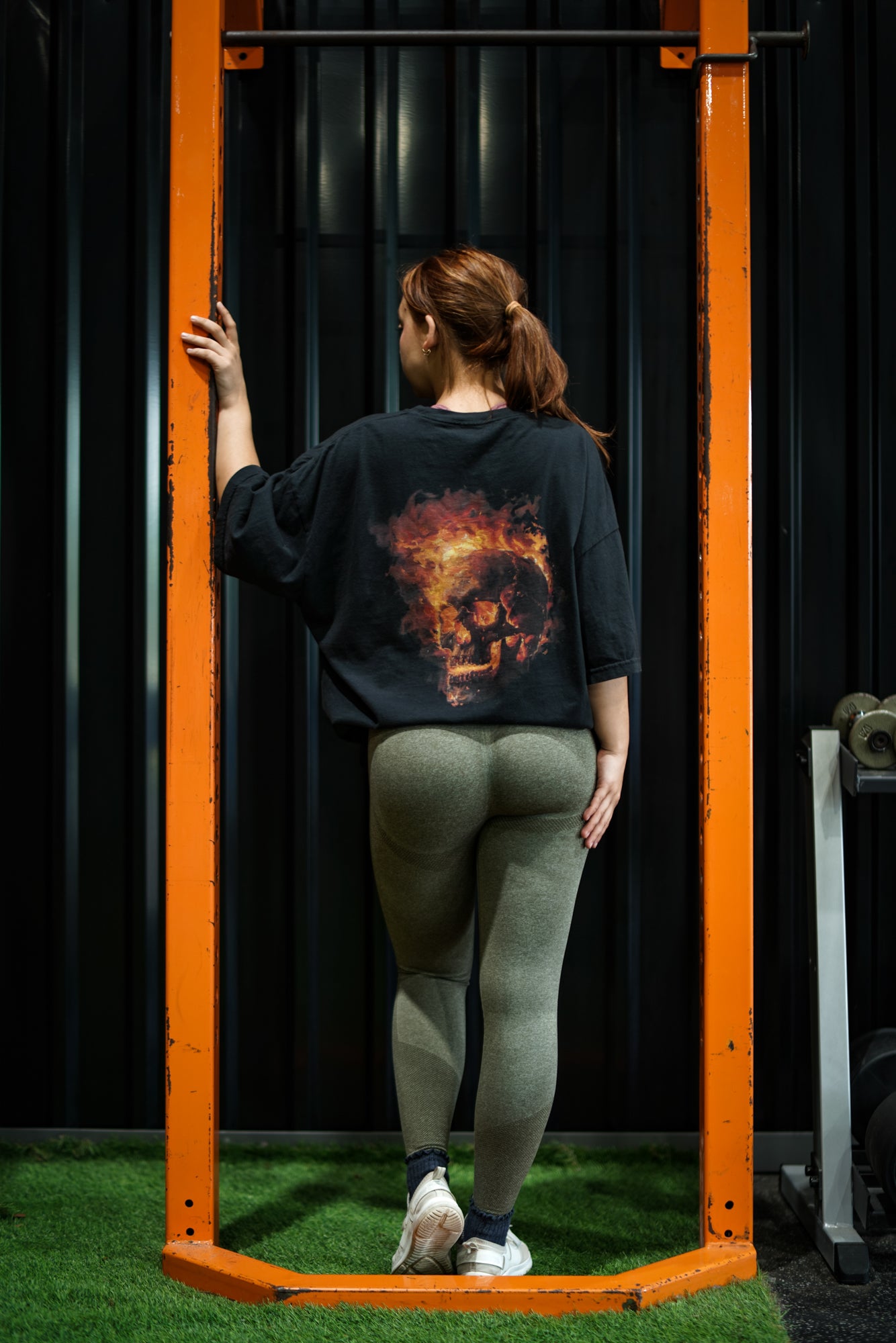 Enferno Burning Skull Tee in Black on model Madelyn.